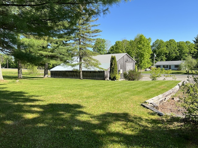 129 Ledge Hill Rd, Corinth, ME 04427 - view of grassy yard featuring a pole building