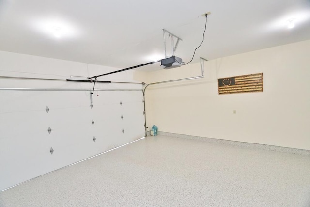 garage featuring baseboards and a garage door opener
