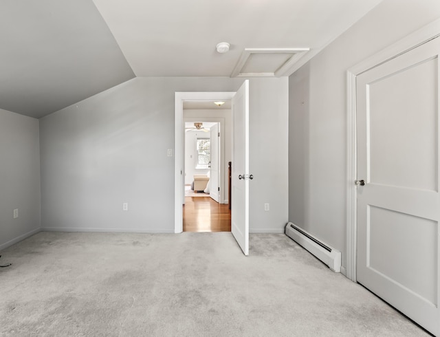 17 US Route 1, Falmouth, ME 04105 - unfurnished bedroom with a baseboard radiator, attic access, carpet floors, vaulted ceiling, and baseboards