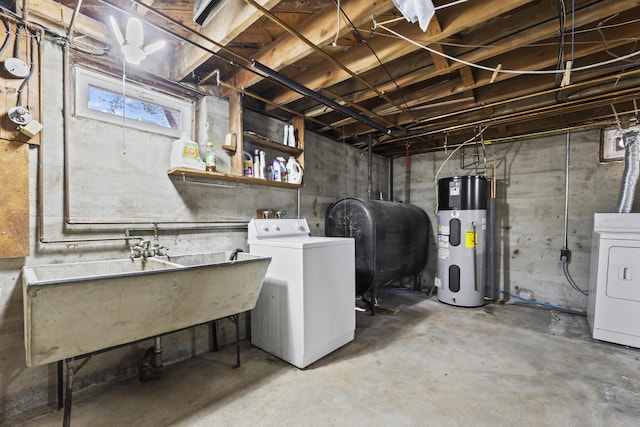 17 US Route 1, Falmouth, ME 04105 - below grade area with heat pump water heater, oil tank, washer and dryer, and a sink