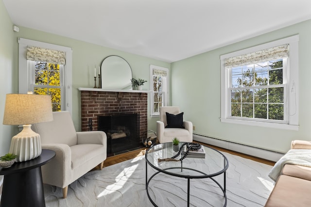 17 US Route 1, Falmouth, ME 04105 - living room with a baseboard radiator, a fireplace, and wood finished floors