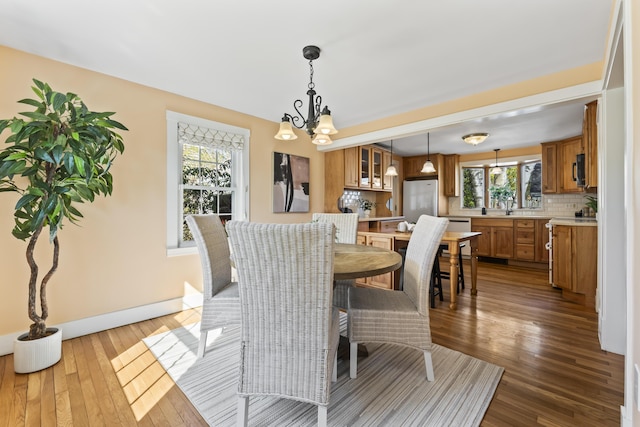 17 US Route 1, Falmouth, ME 04105 - dining room featuring healthy amount of natural light, dark wood finished floors, and baseboards