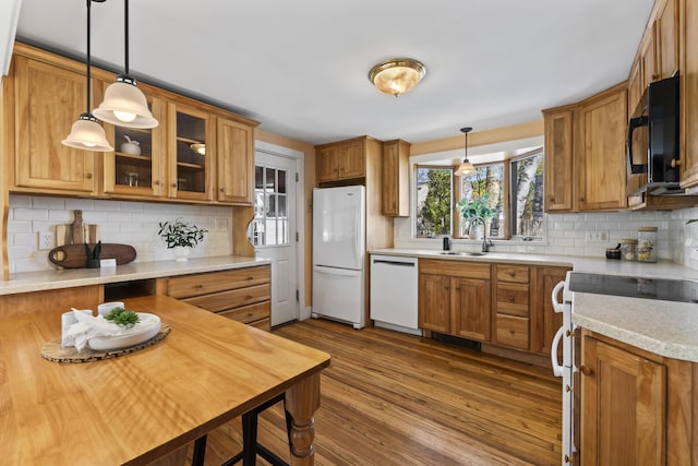 17 US Route 1, Falmouth, ME 04105 - kitchen with white appliances, a sink, backsplash, and brown cabinets