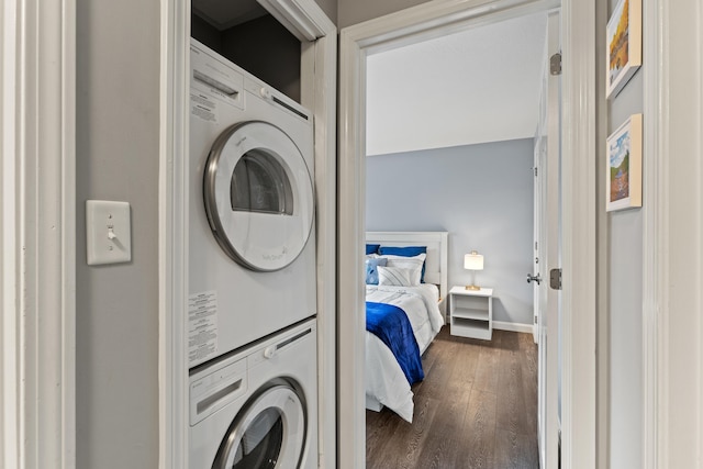 21 Valley St Unit 1, South Portland, ME 04106 - laundry room featuring stacked washer / dryer and dark wood-type flooring