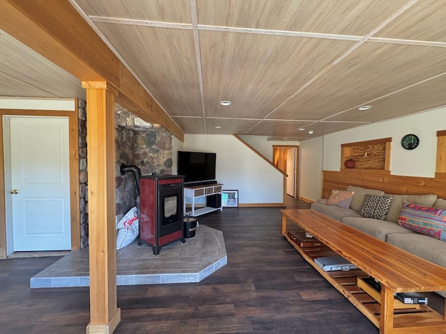 living area with wood ceiling, a wood stove, recessed lighting, and wood finished floors