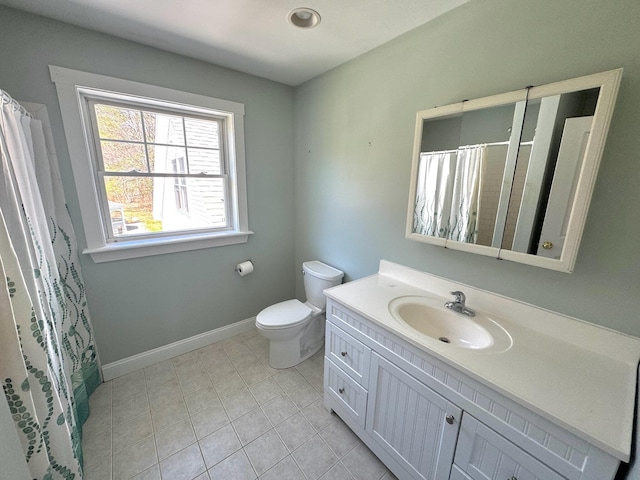 bathroom with tile patterned flooring, vanity, toilet, a shower with shower curtain, and baseboards