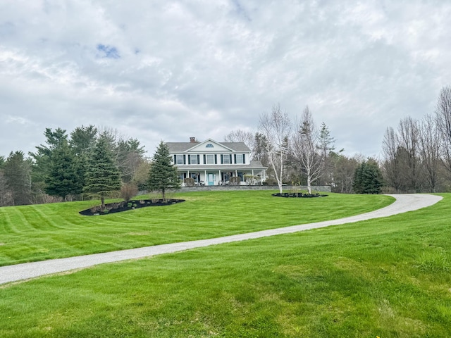 view of property's community featuring a lawn