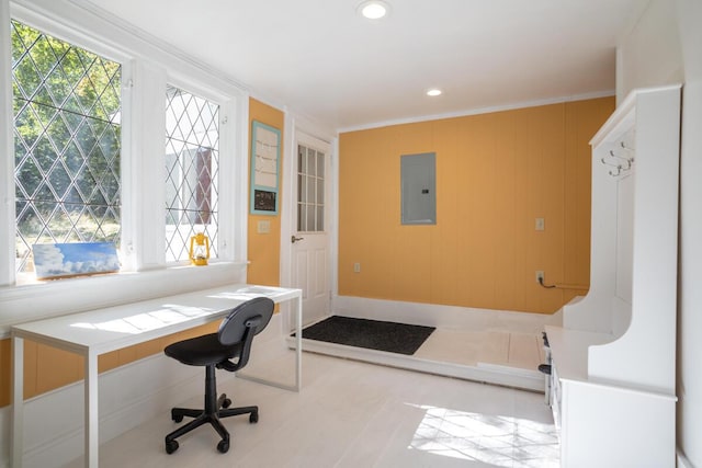 home office featuring electric panel, crown molding, recessed lighting, and built in desk