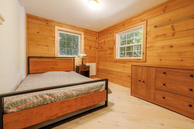 bedroom with wooden walls