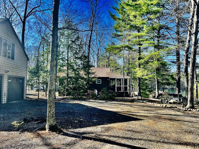 view of front of home with an attached garage and aphalt driveway
