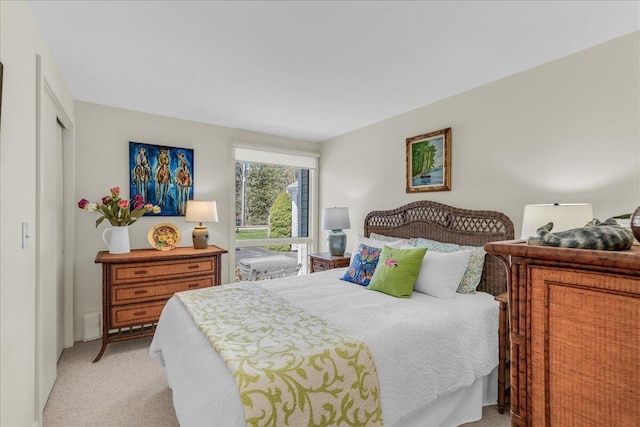 bedroom with light colored carpet