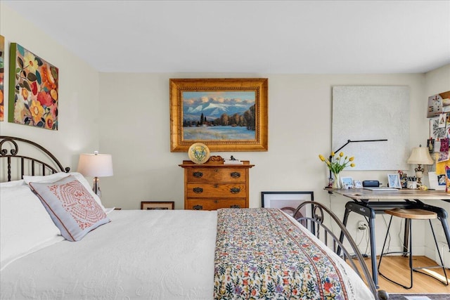 bedroom with wood finished floors