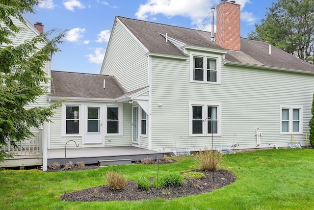 10 Ephraim Tyler Way Unit 10, Kennebunk, ME 04043 - rear view of house featuring a deck, a lawn, a chimney, and roof with shingles