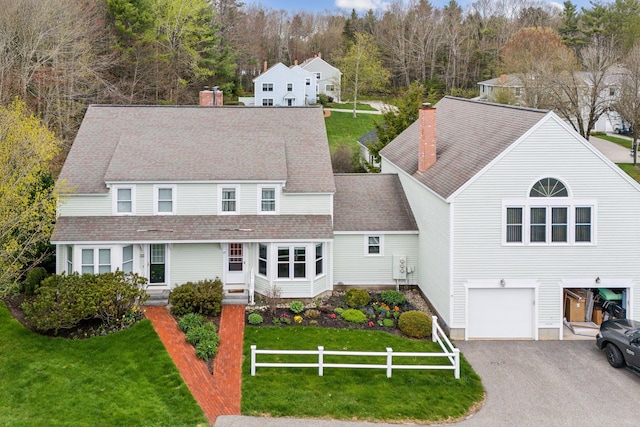 10 Ephraim Tyler Way Unit 10, Kennebunk, ME 04043 - view of front of home featuring a chimney, a garage, driveway, and roof with shingles