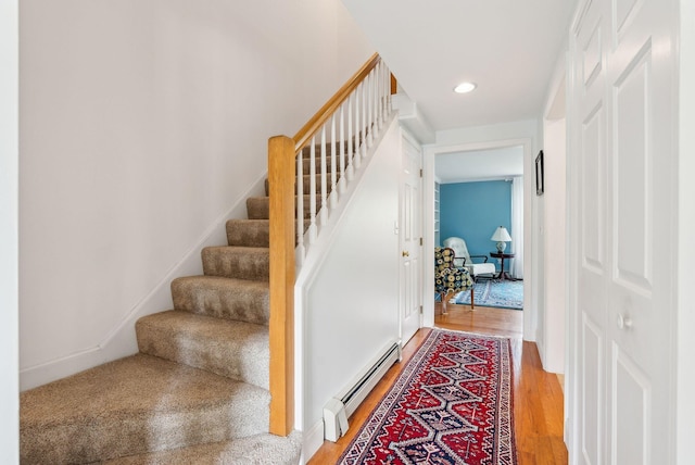 10 Ephraim Tyler Way Unit 10, Kennebunk, ME 04043 - stairway with a baseboard heating unit, wood finished floors, and recessed lighting