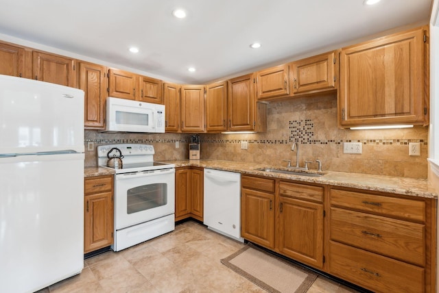 10 Ephraim Tyler Way Unit 10, Kennebunk, ME 04043 - kitchen featuring white appliances, a sink, tasteful backsplash, light stone countertops, and recessed lighting