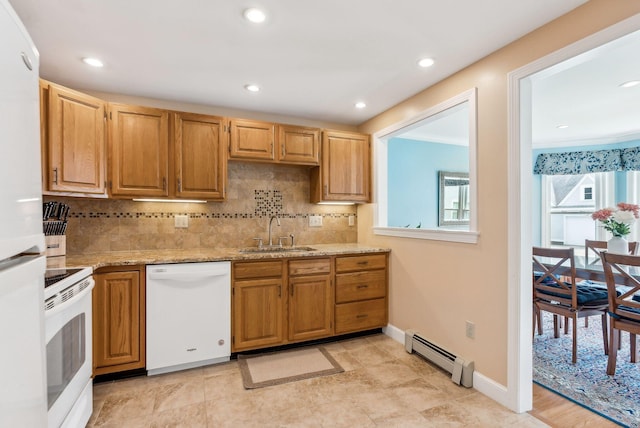 10 Ephraim Tyler Way Unit 10, Kennebunk, ME 04043 - kitchen with white appliances, a sink, baseboard heating, backsplash, and recessed lighting