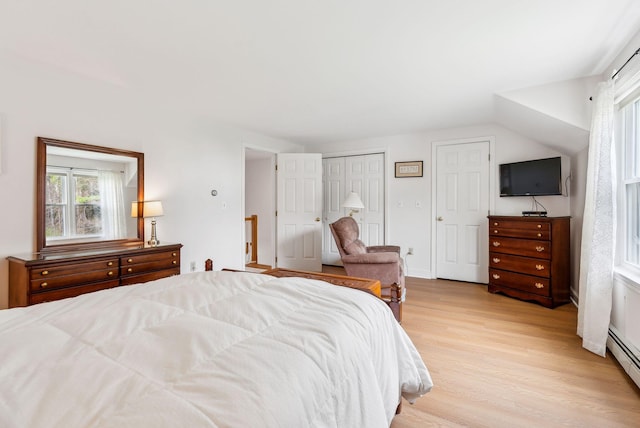 10 Ephraim Tyler Way Unit 10, Kennebunk, ME 04043 - bedroom with multiple windows, light wood-style flooring, and a baseboard radiator