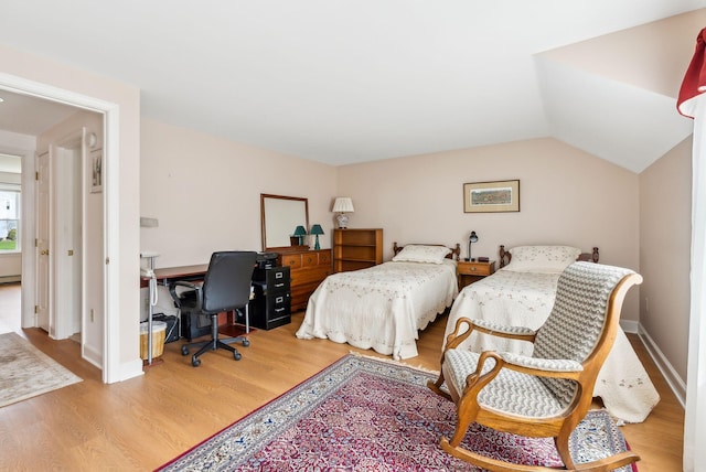10 Ephraim Tyler Way Unit 10, Kennebunk, ME 04043 - bedroom featuring wood finished floors, a desk, vaulted ceiling, and baseboards