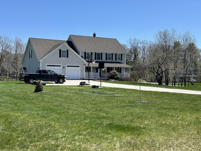 view of front of house with concrete driveway, a chimney, a front yard, and a garage