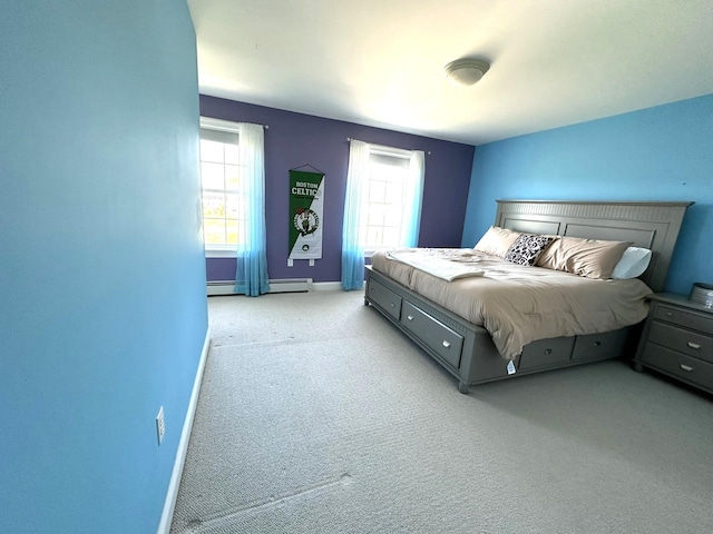 bedroom featuring baseboards, light colored carpet, and a baseboard radiator