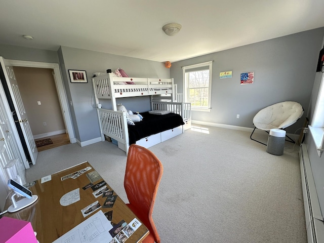 carpeted bedroom featuring baseboards and a baseboard radiator