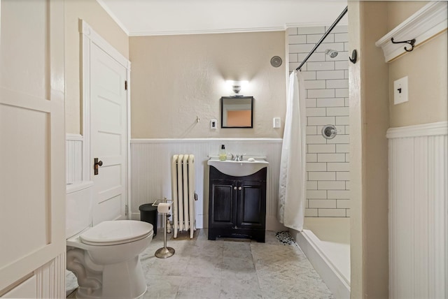 full bathroom featuring toilet, a wainscoted wall, a stall shower, and radiator