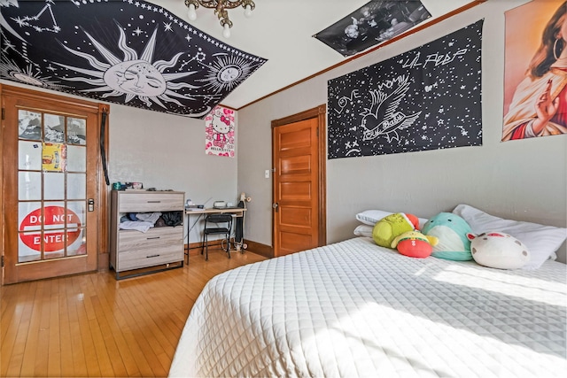 bedroom with wood-type flooring