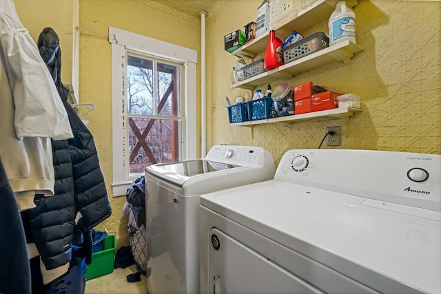 clothes washing area with independent washer and dryer and laundry area
