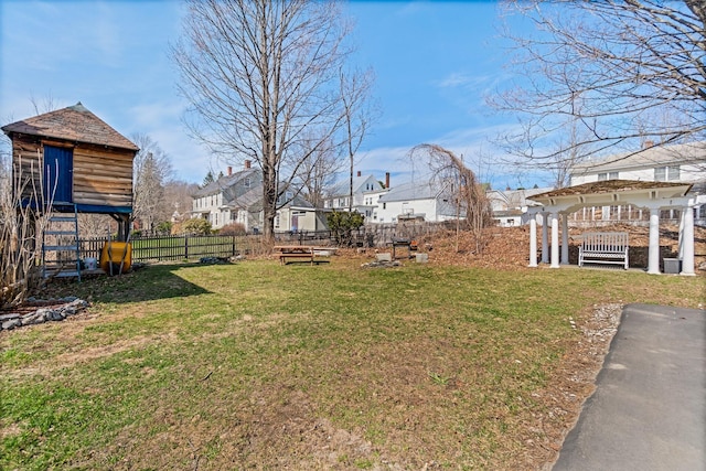 view of yard with fence and a residential view
