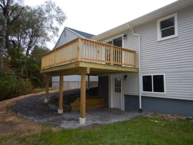 back of house with a wooden deck