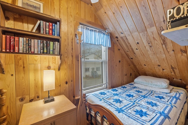 bedroom with vaulted ceiling and wood walls
