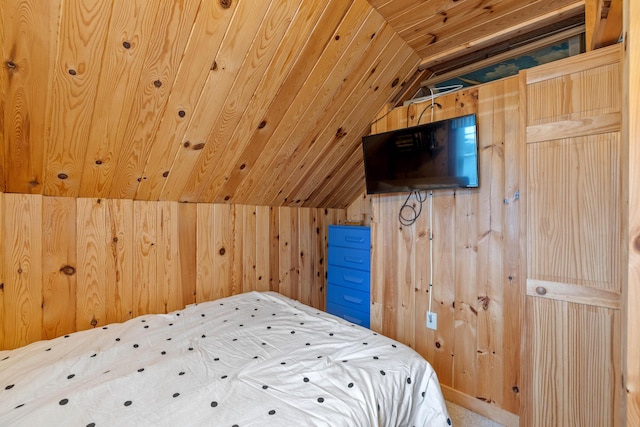 bedroom with lofted ceiling, wood walls, and wooden ceiling
