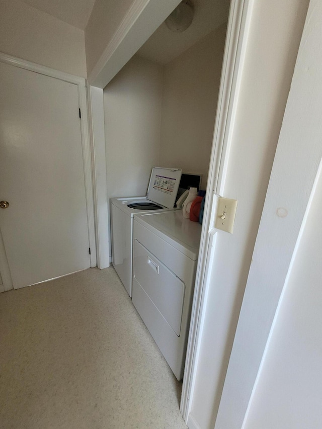 washroom with washer and dryer