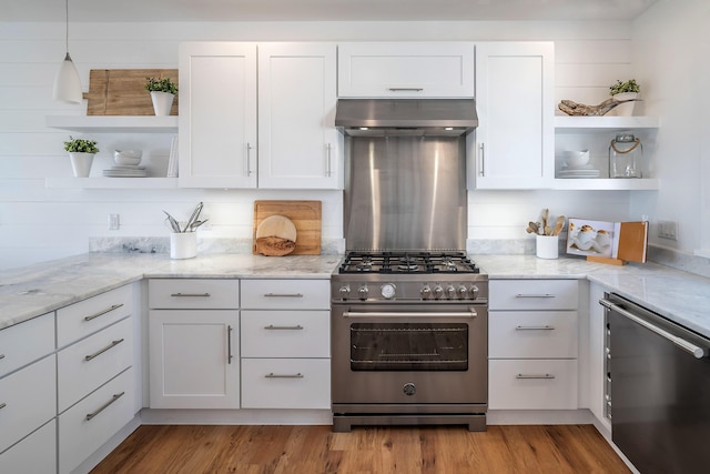 kitchen with under cabinet range hood, open shelves, appliances with stainless steel finishes, and white cabinetry