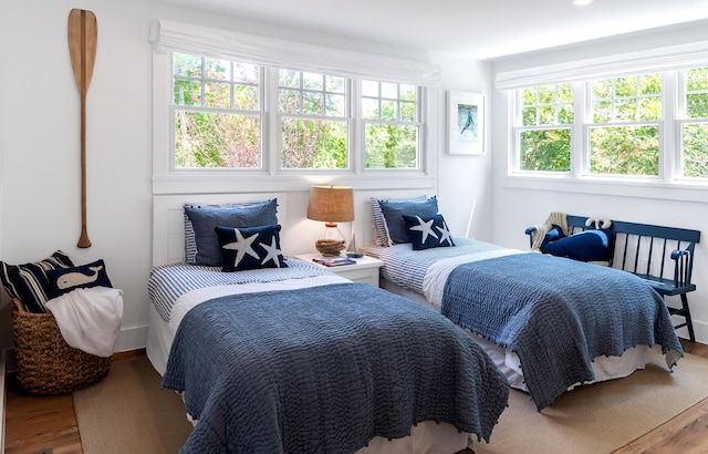 bedroom featuring wood finished floors