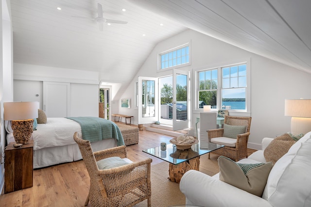 bedroom with high vaulted ceiling, light wood-style flooring, and recessed lighting