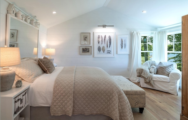 bedroom featuring recessed lighting, vaulted ceiling, and wood finished floors