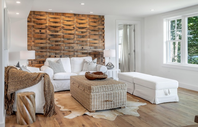 living area featuring recessed lighting, wood finished floors, and baseboards