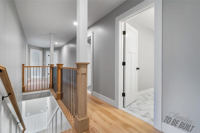 4-16 Tatnic Rd, Wells, ME 04090 - hall featuring marble finish floor, baseboards, an upstairs landing, and recessed lighting