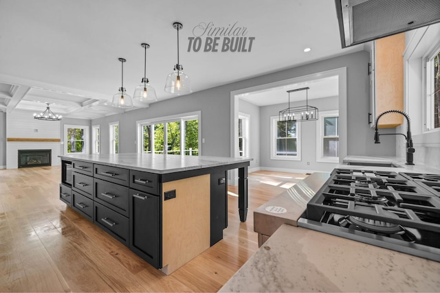 4-16 Tatnic Rd, Wells, ME 04090 - kitchen with a notable chandelier, open floor plan, and light wood-style floors