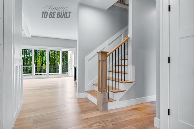 4-16 Tatnic Rd, Wells, ME 04090 - staircase with wood finished floors and baseboards
