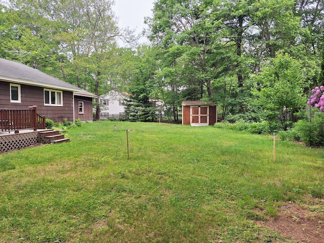 31 Arbor Ave, Topsham, ME 04086 - view of grassy yard featuring a storage unit and a wooden deck