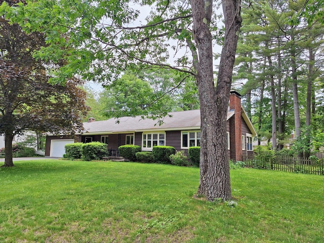 31 Arbor Ave, Topsham, ME 04086 - view of front facade with a chimney and an attached garage