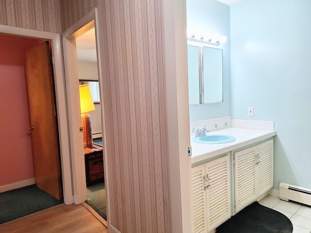 31 Arbor Ave, Topsham, ME 04086 - bathroom with a baseboard heating unit, vanity, wood finished floors, and a baseboard radiator