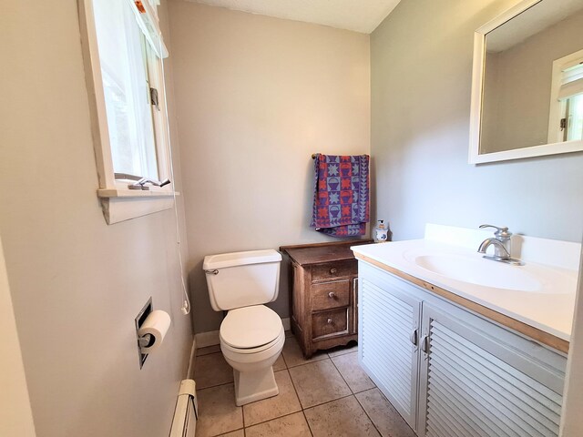 31 Arbor Ave, Topsham, ME 04086 - bathroom featuring baseboard heating, vanity, and tile patterned flooring