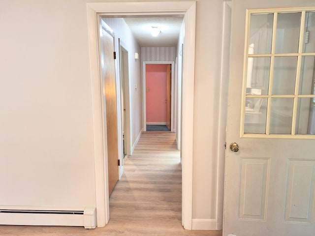 31 Arbor Ave, Topsham, ME 04086 - hallway with baseboard heating and light wood-style flooring