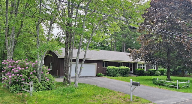 31 Arbor Ave, Topsham, ME 04086 - ranch-style house with an attached garage, a front yard, and asphalt driveway