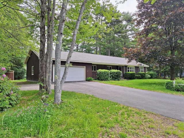 31 Arbor Ave, Topsham, ME 04086 - ranch-style house featuring an attached garage, asphalt driveway, and a front lawn