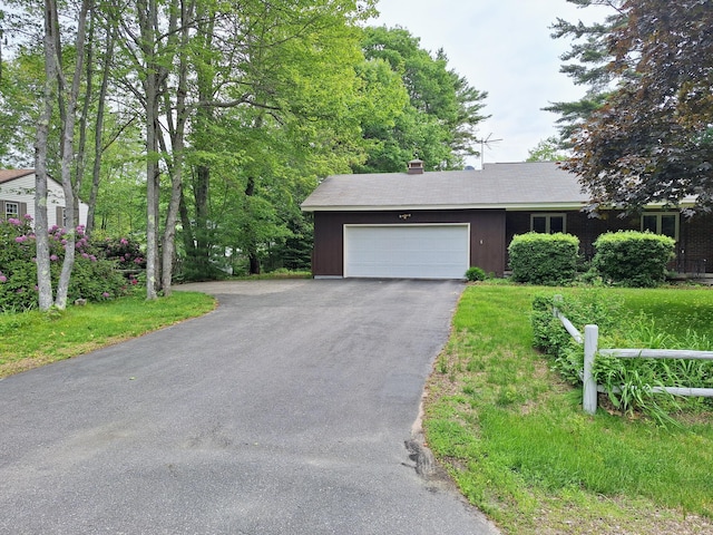 31 Arbor Ave, Topsham, ME 04086 - ranch-style house with asphalt driveway, a garage, and a chimney